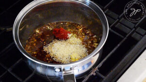 Sauce ingredients simmering in a sauce pot.