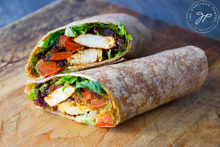 A font view of the cut, finished and stacked Fajita Wrap on a cutting board.