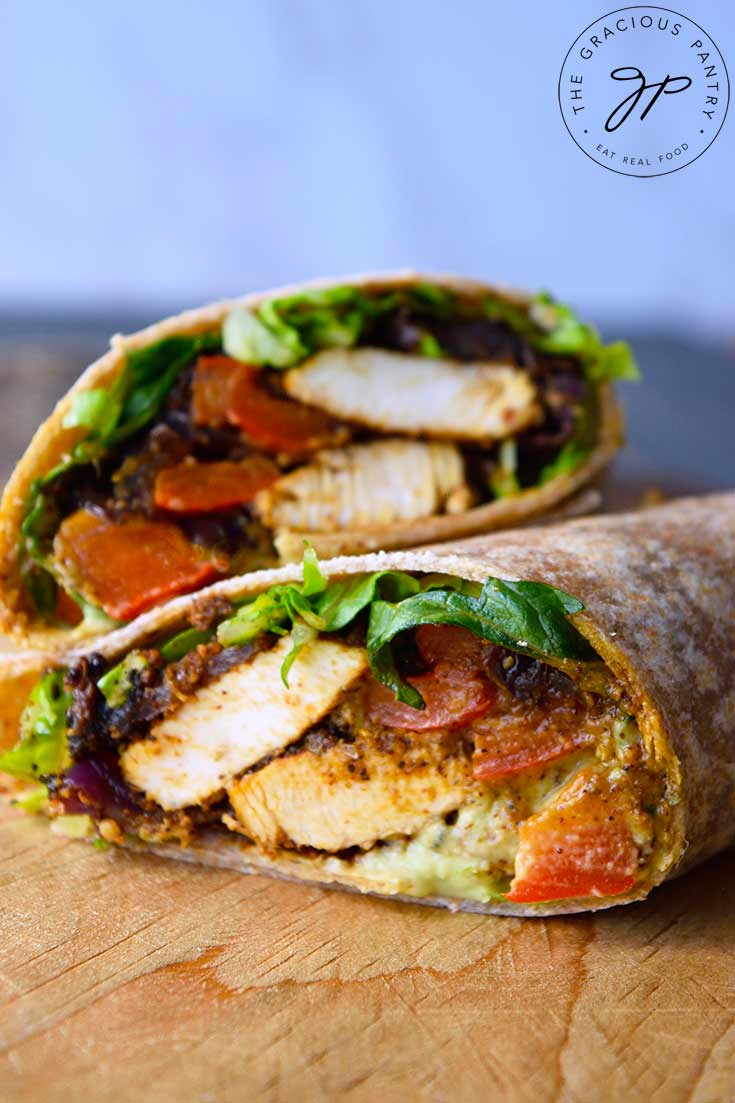 An up close shot of a fajita wrap cut and stacked on a cutting board.