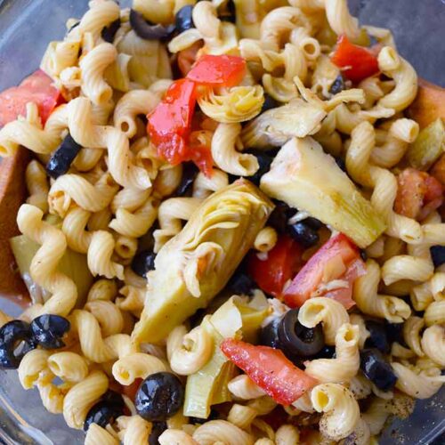 An overhead view looking down on a bowl of Greek Pasta Salad.