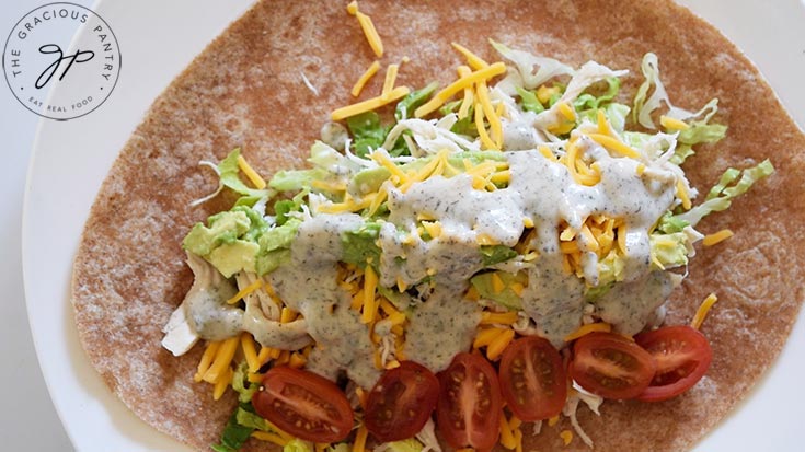 Ranch dressing drizzled over all the other fillings of this Ranch Chicken Wraps Recipe.