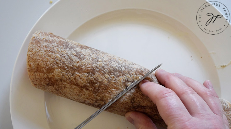 Slicing a Ranch Chicken Wrap in half.