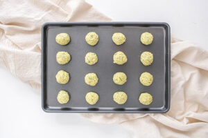 Air Fryer Falafel balls sitting on a baking sheet.