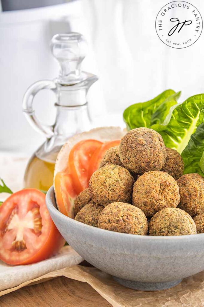 A close up view of a gray bowl filled with Air Fryer Falafel balls.