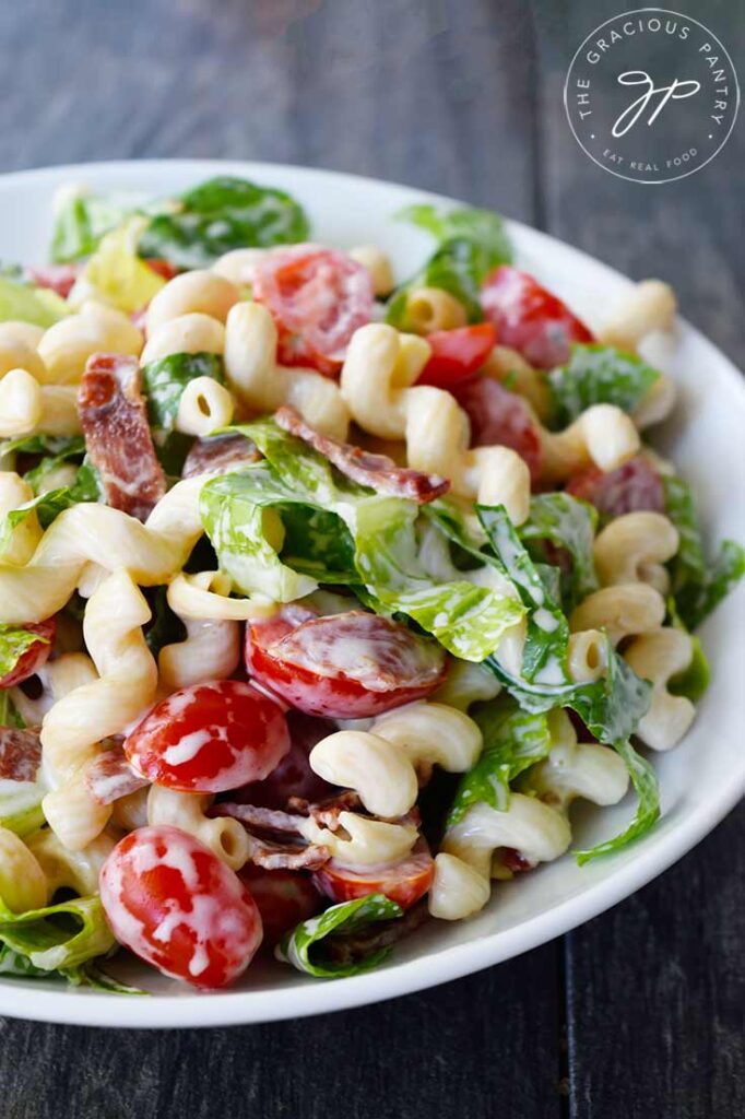 And up close view of a white bowl filled with BLT Pasta Salad.