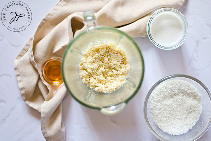 Almond flour in a tall mixing blass.