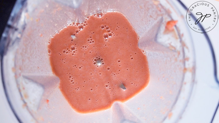 Strawberry sauce blended in a blender cup.