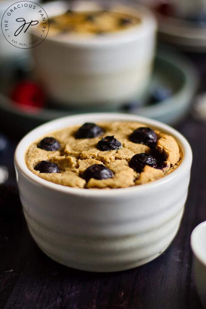 An up close view of a white ramekin filled with Blended Baked Oatmeal.