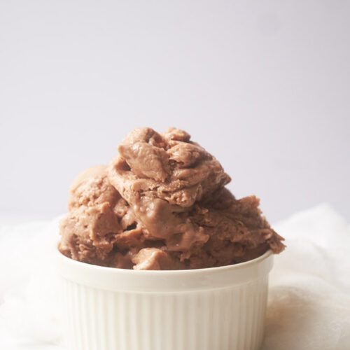 A white bowl filled with Chocolate Banana Nice Cream.