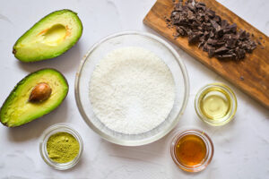 All the Matcha Energy Balls Recipe ingredients gathered onto a white surface.