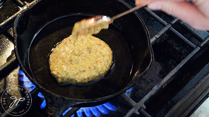 Gluten-free hotcakes batter being cooked in an oiled skillet.