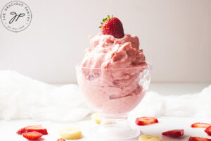 The finished Healthy Strawberry Ice Cream served in a glass ice cream dish.