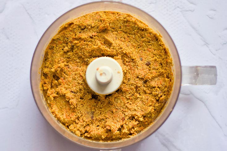Gluten-Free Carrot Cake dough, blended and sitting in a food processor.
