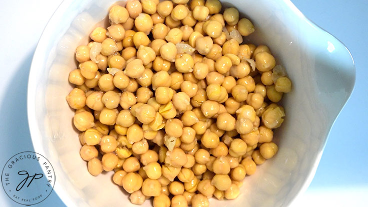 Chickpeas in a white mixing bowl.