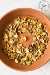 Sautéd mushrooms in a skillet.