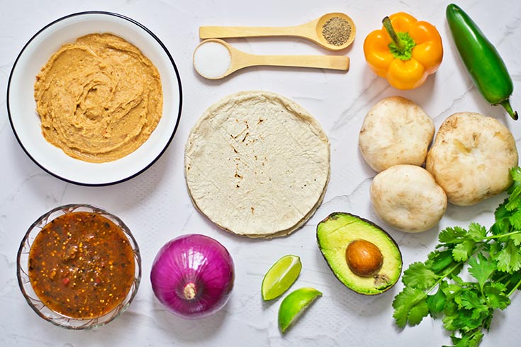 Vegan Mushroom Taco ingredients individually laid out on a white surface.