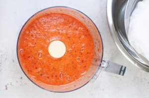 Blended Immunity Booster Shots sitting in a food processor bowl.