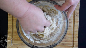 Kneading oat flour flatbread dough.