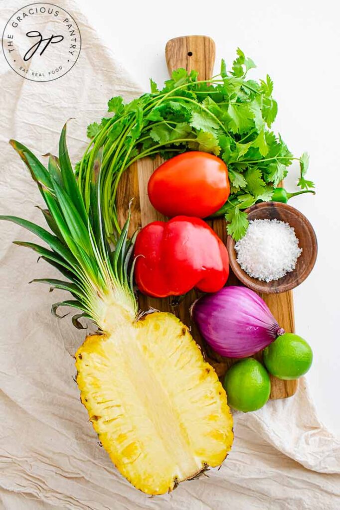 A beautiful arrangement of all the ingredients used in this pineapple salsa recipe.