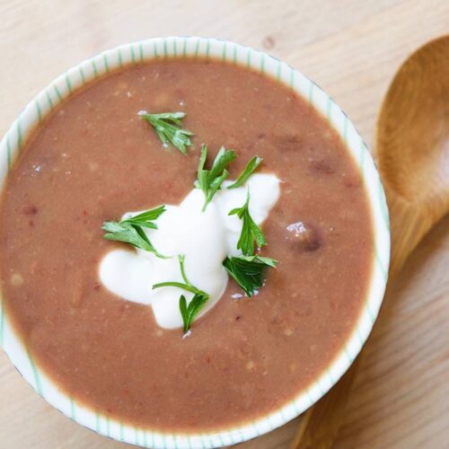 And overhead shot looking down into a small bowl of Refried Bean Soup.