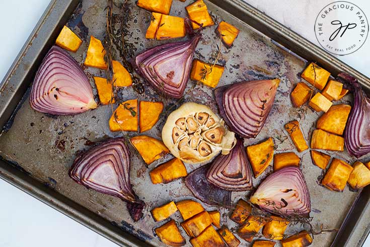 The roasted vegetables on a sheet pan, just out of the oven.