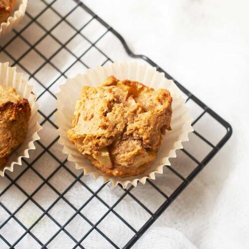 Cinnamon Apple Muffins cooling on a wire cooling rack.