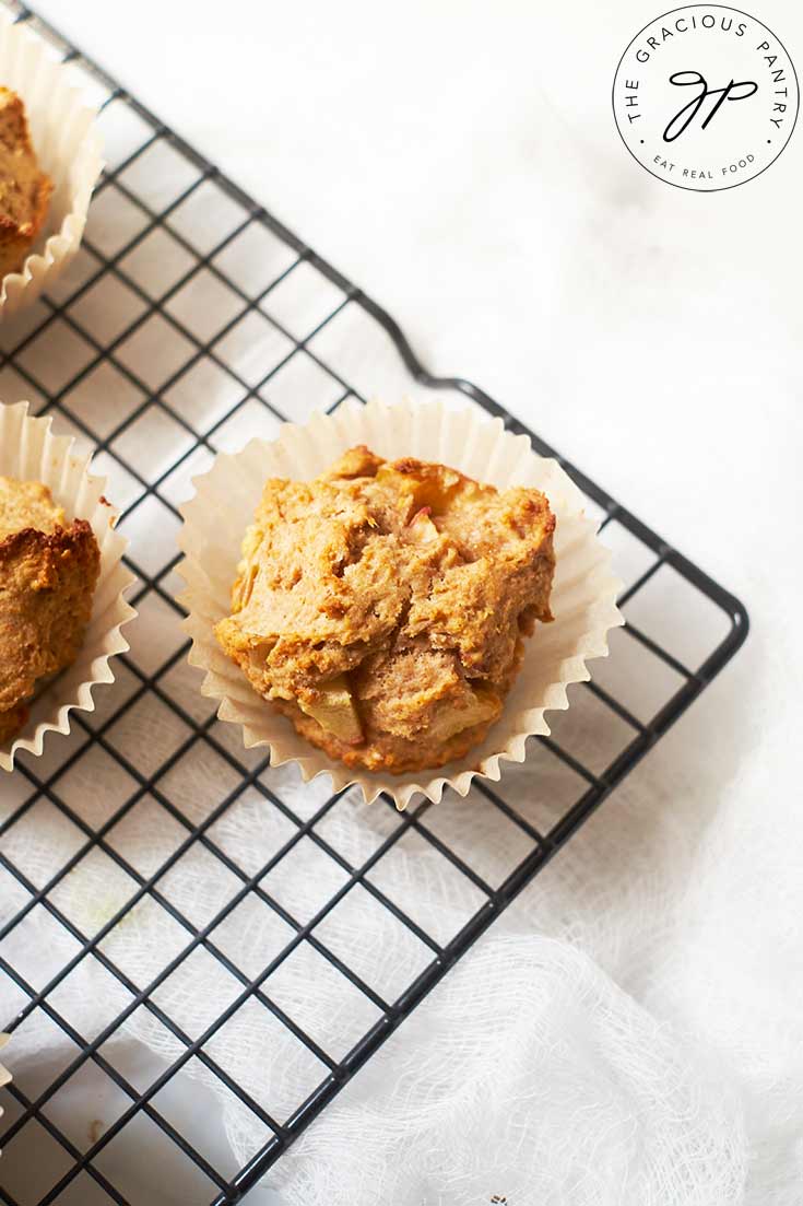 Cinnamon Apple Muffins cooling on a wire cooling rack.