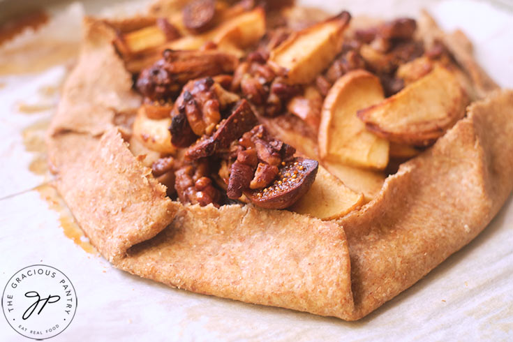 A just-baked Fig Galette cooling on white parchment.