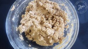 Gluten-Free Pumpkin Biscotti dough sitting in a mixing bowl.