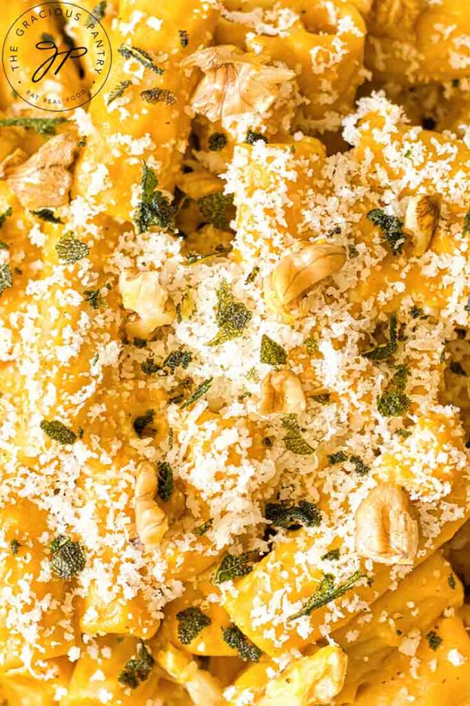 An extra up close shot of Pumpkin Pasta sprinkled with parmesan and chopped walnuts.
