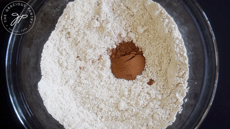 Flour and spices sitting in a mixing bowl.