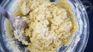 Witch Finger Cookie dough mixed together in a glass mixing bowl.