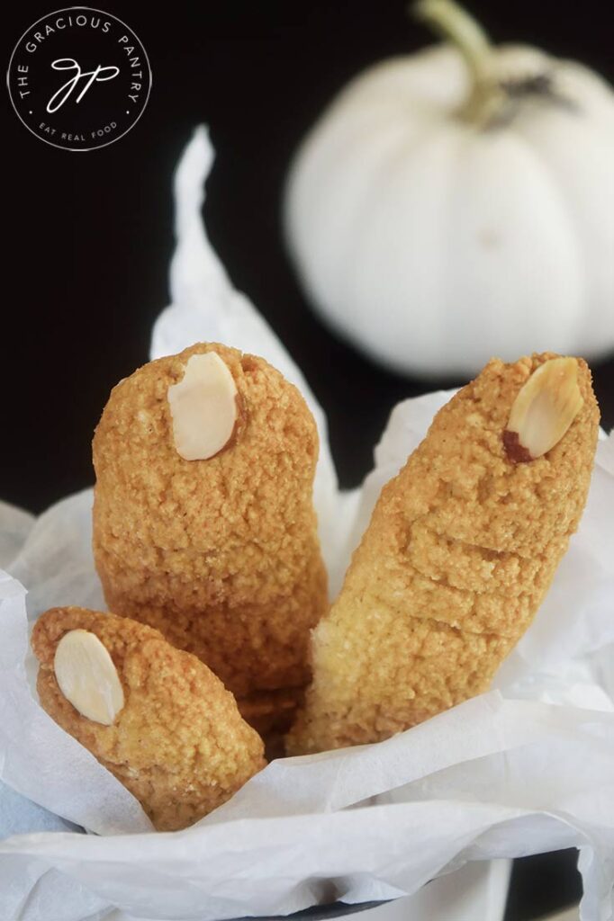 A close up of three witch finger cookies.