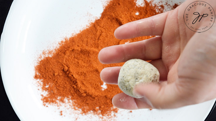 A small portion of seasoned cream cheese rolled into a ball.