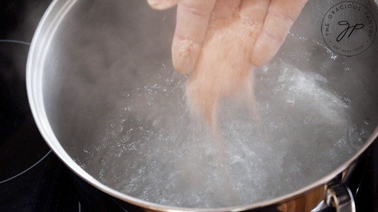 Adding salt to pasta water.