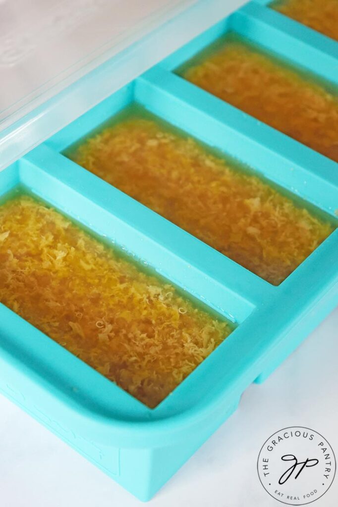 A Souper Cubes tray sits filled with Sick Day Soup.