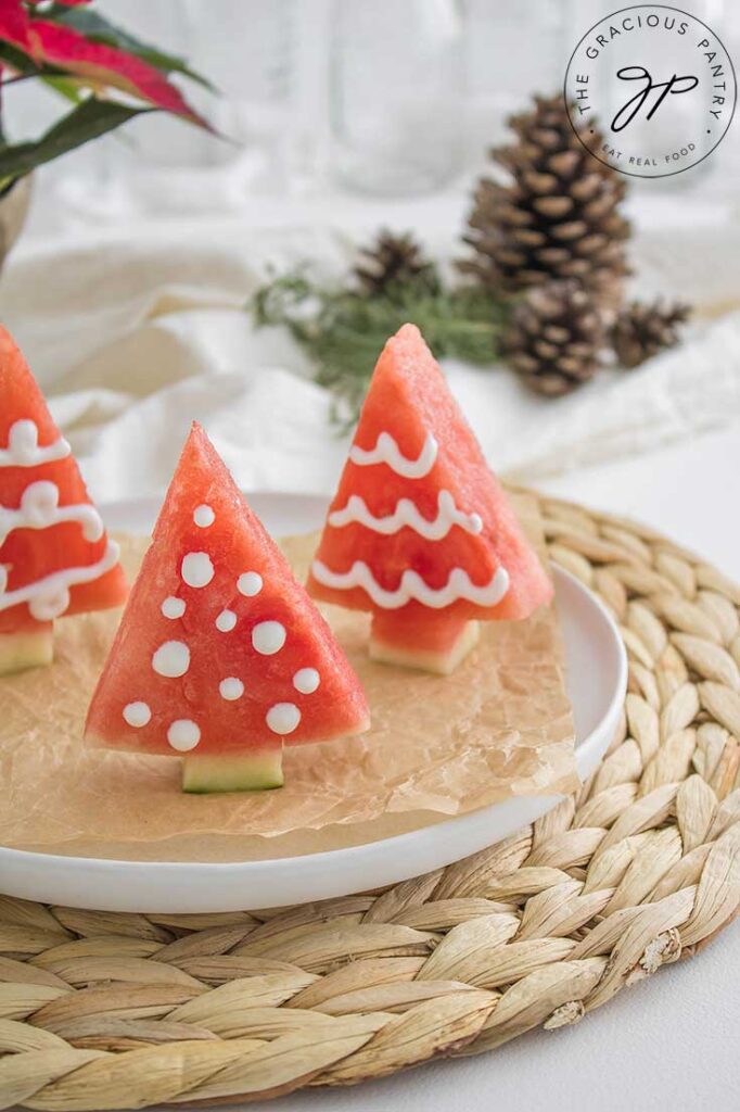 A side view of Watermelon Christmas Trees on a platter.