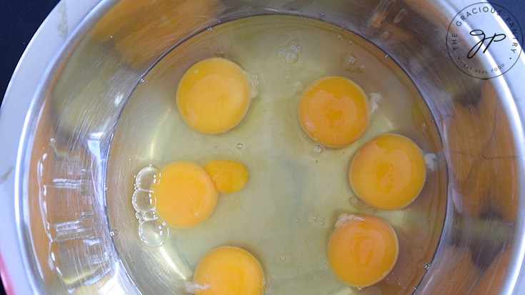 Egg whites and yolks in a mixing bowl.