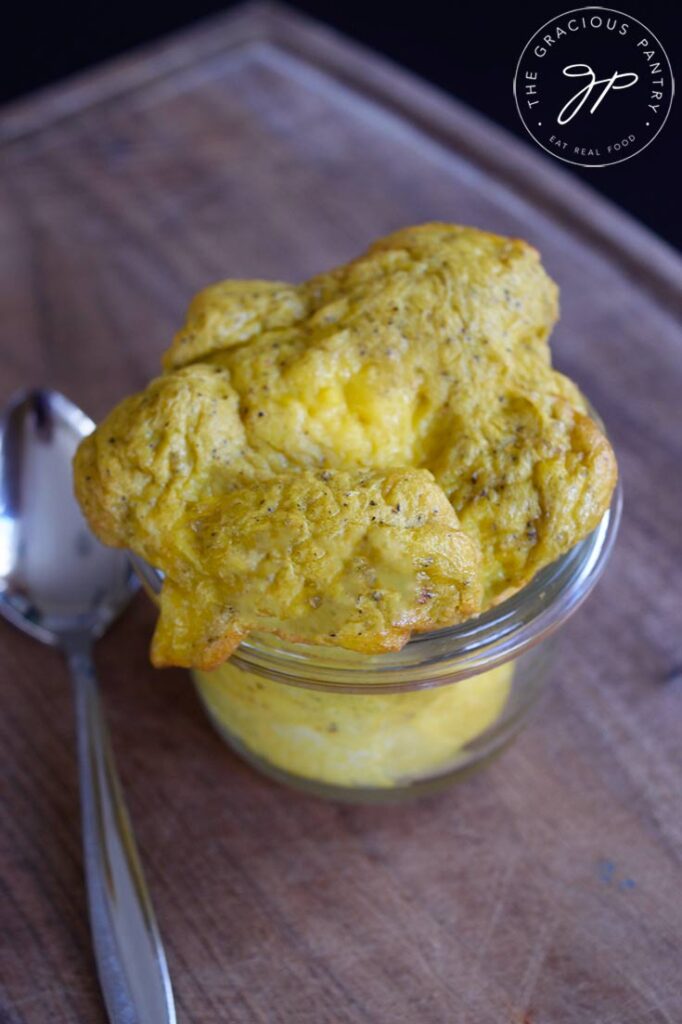 A glass container filled with Air Fryer Scrambled Eggs.