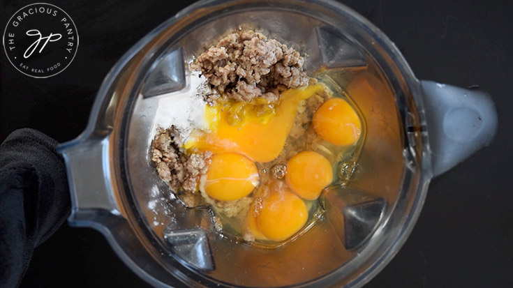 Eggs added to cooked ground turkey and baking powder in a blender.
