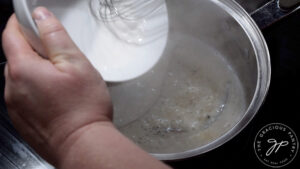 Pouring slurry into simmering coffee creamer.