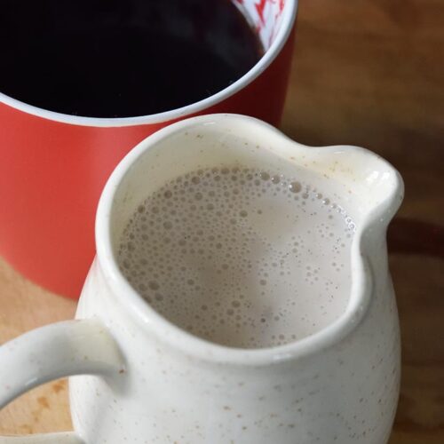 A pitcher full fo French vanilla coffee creamer.