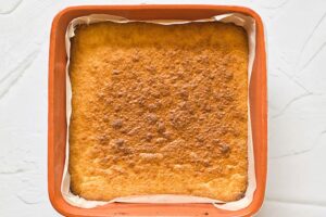 Just baked Healthy Twix Bars crust in a baking pan.
