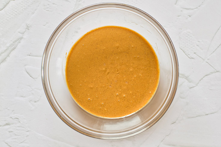 Natural peanut butter in a mixing bowl.