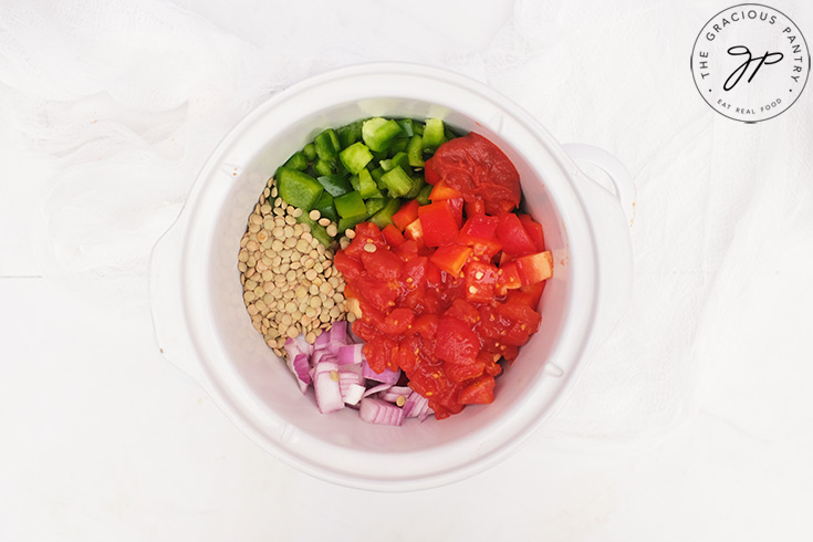 Lentil Sloppy Joes Recipe ingredients sitting in a white slow cooker.