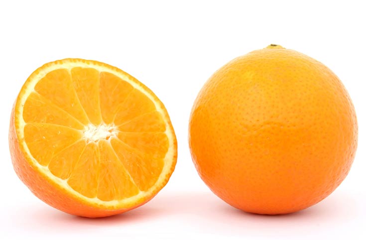 A whole orange and a half orange on a white background.