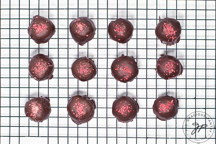 Raspberry Coconut Truffles topped with raspberry powder.