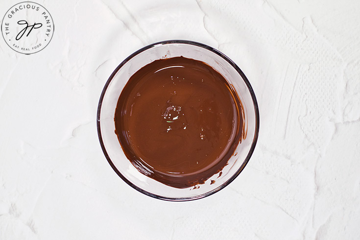 A bowl of melted chocolate.