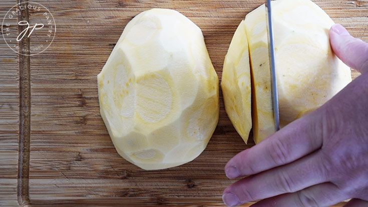 Cutting rutabaga slices into french fries.