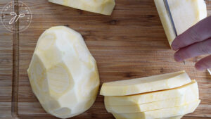 Slicing a rutabaga.